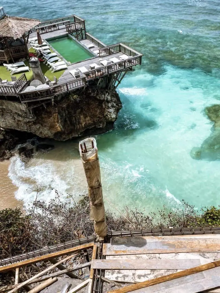 Scenic coastal imagery capturing the beauty of Uluwatu Bali's shoreline and crystal clear water.