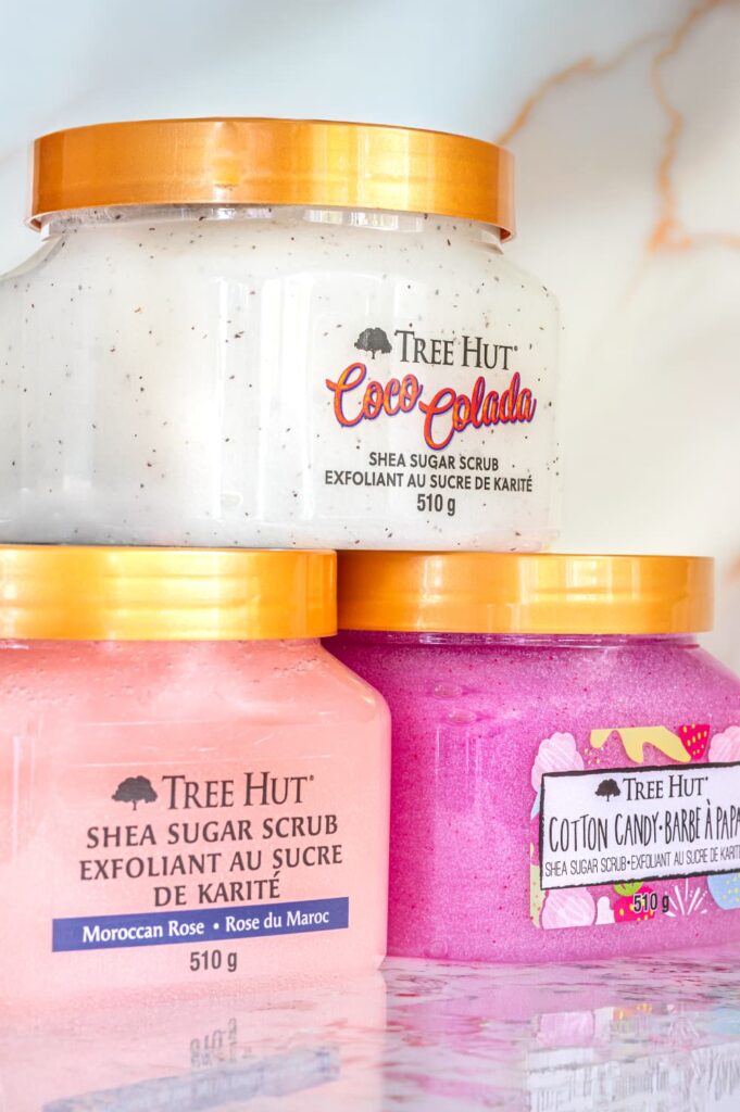 Three Tree Hut body scrubs arranged for professional commercial product photography with clean studio lighting.