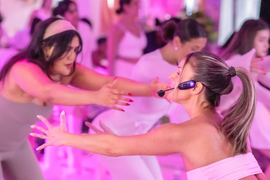 Pilates instructor guiding participants through a class at a Pangea Pilates event in Montreal.